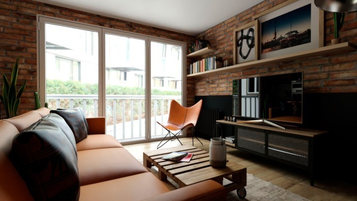 Industial kitchen and dining room with black and wooden furnitures, a leather sofa and leather chair, a pallet table and a TV